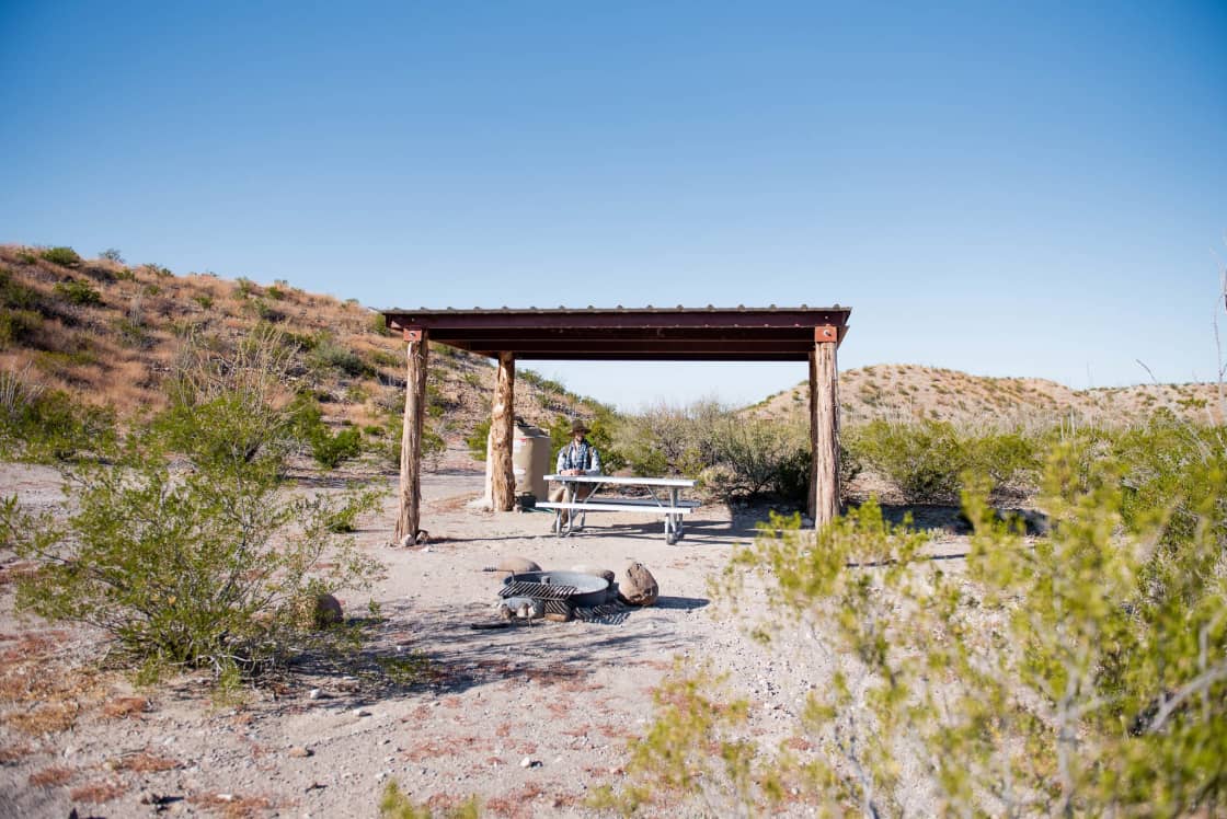 Shade structure and fire ring at the Star Party campsite
